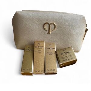 Clé de Peau Beauté Gold make up bag and skin care